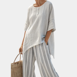 Fiorella | Blouse asymétrique élégante et pantalons rayés